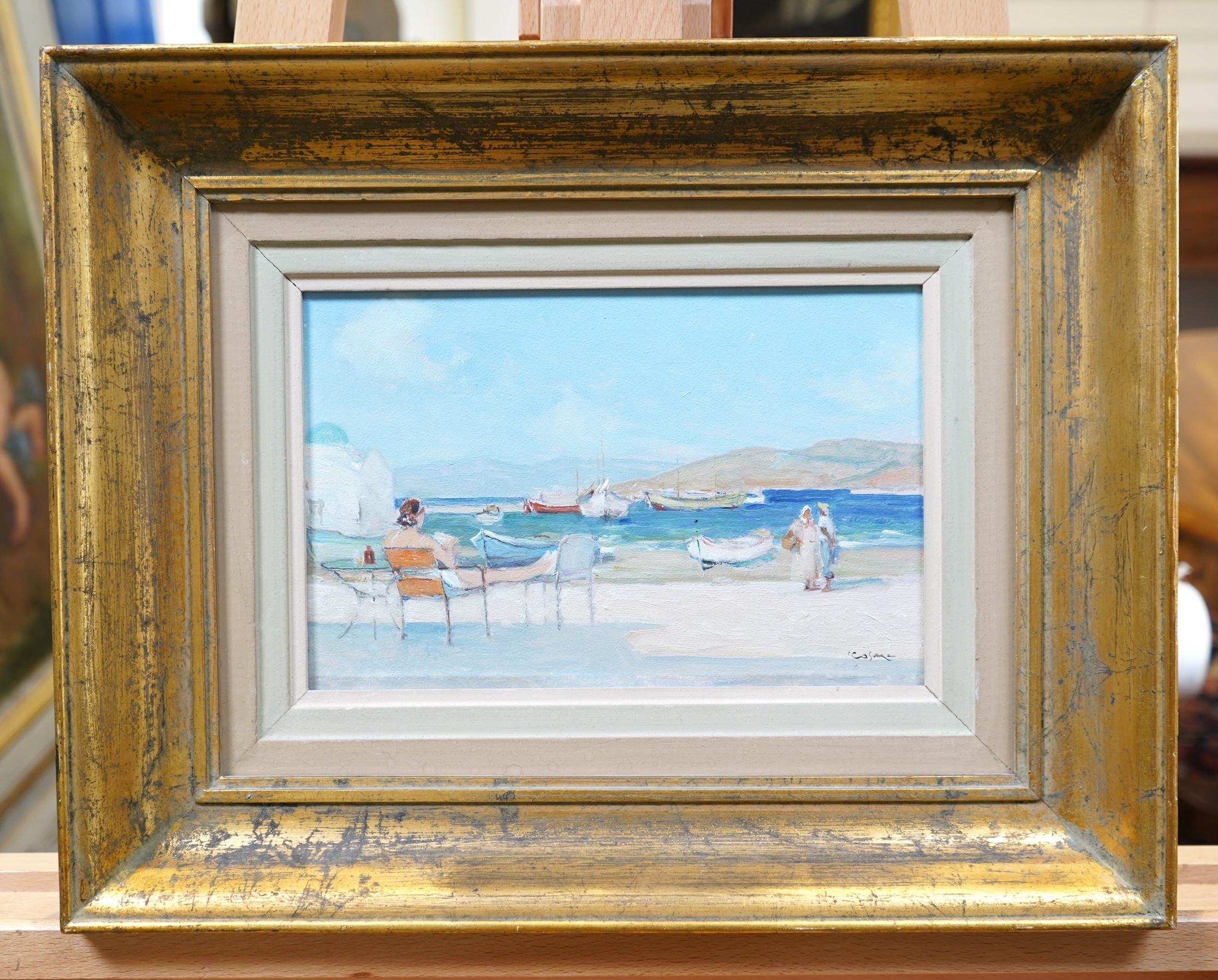 Georgios Kosmadopoulos, Greek 1895-1967, A Greek coastal scene with a figure relaxing to the foreground